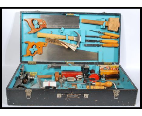 A vintage mid 20th Century ebonised wood working work box, the hinged lid opening to reveal a fully appointed interior with v