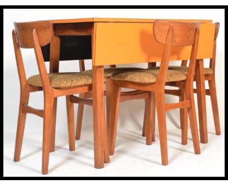 A stunning vintage 20th Century circa 1960's dining suite, consisting of a orange laminated topped drop leaf dining table rai