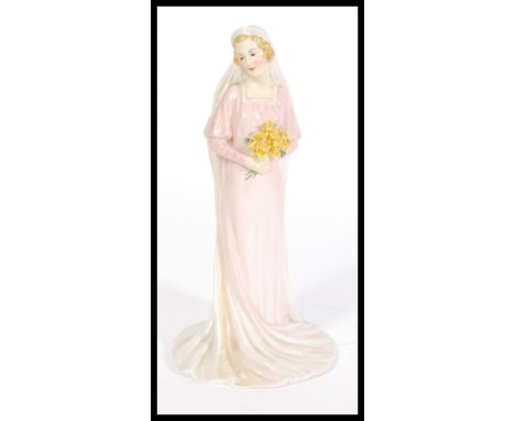 A Royal Doulton ceramic figurine HN1600 'The Bride&nbsp;designed by Arthur Leslie Harradine. Stamped to base. Measures 23cm h