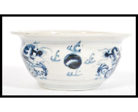 A believed 17th / 18th Century Chinese blue and white ceramic bowl having hand painted decoration of Dragons chasing the flam