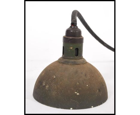 A vintage early 20th century Industrial factory pendant trouble&nbsp; / inspection lamp. Half moon shade set to a cable with 