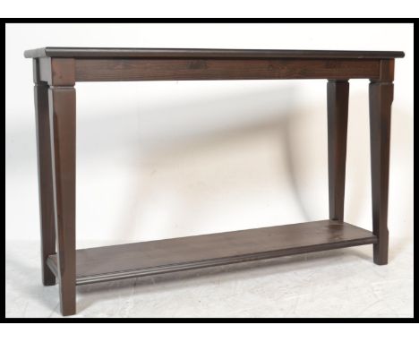 A 20th century contemporary oak console table of rectangular form having square tapering legs united by twin tiers.&nbsp;Meas