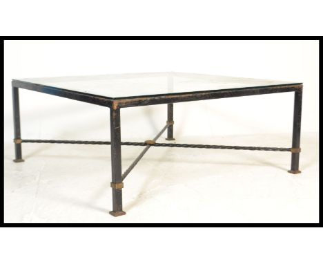 A vintage retro 20th Century cast metal coffee table of large square form having a large glass top over x frame square base.&