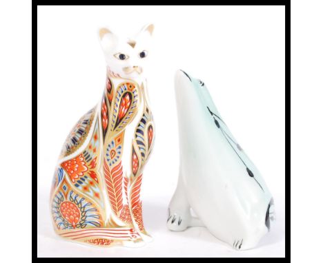 A Royal Crown Derby Imari paperweight in the form of a cat having a silver stopper along with a ceramic frog having water ree