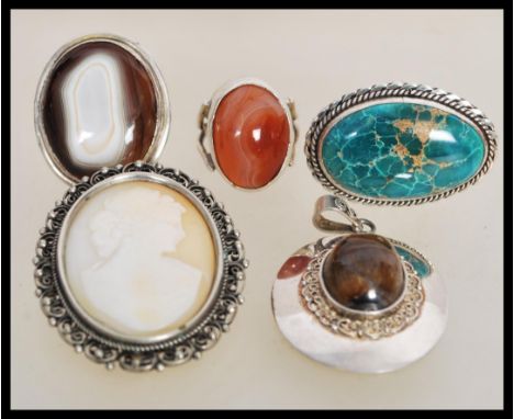 A group of sterling silver large agate stone jewellery to include a carnelian ring, blue moss stone ring, agate ring, tigers 