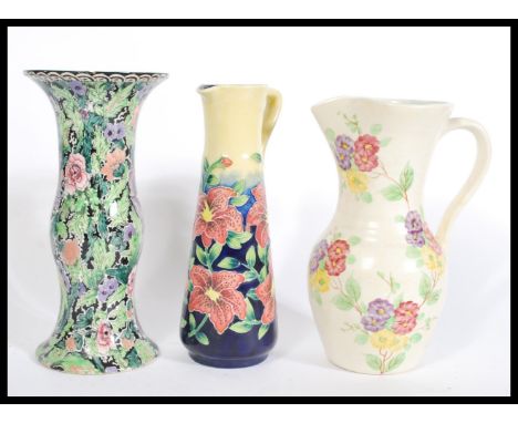 A group of vintage 20th century jugs to include an Old Tupton Ware tall jug of cylindrical tapering form having tubeline deco