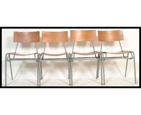 A set of four vintage retro 20th Century ply stacking school chairs raised on tubular supports.&nbsp;Measures: 78cm high x 50