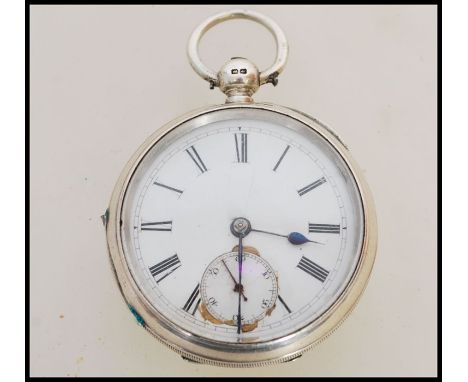 A 19th century Victorian silver hallmarked pocket watch having a fusee movement. The white enamel face having a Roman numeral