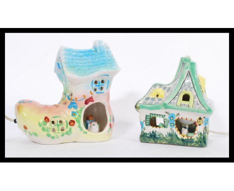 Two novelty ceramic children's lights to include the old woman who lived in a shoe boot lamp with painted floral decoration a