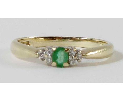 A 9 carat gold emerald and diamond ring, the emerald with a trio of single cuts to each shoulder, finger size P, 1.9g gross 