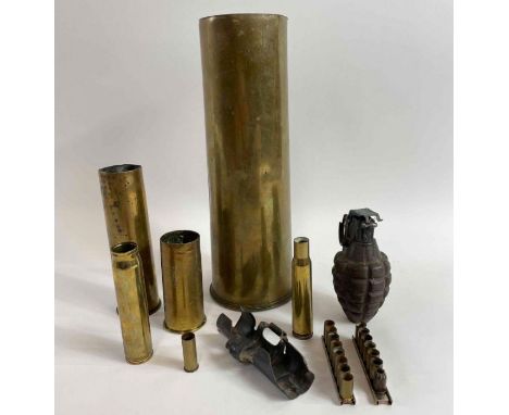 A collection of copper gun shells, castings and a dummy hand grenade 