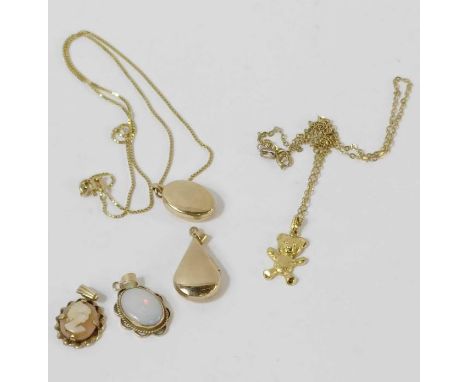 A 9 carat gold oval locket on a chain; a teddy charm on a chain; an opal pendant; a 9 carat gold Celtic locket; and a shell c