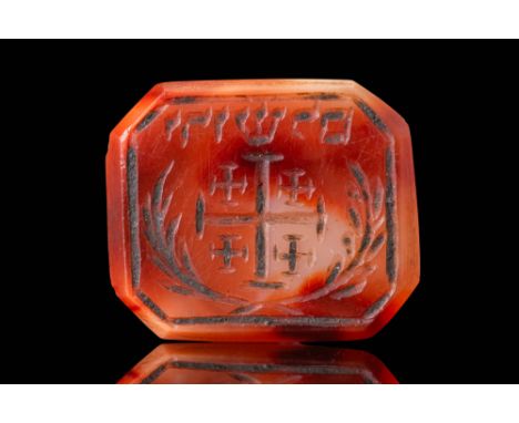 Ca. AD 1100 - 1300. An octagonal carnelian intaglio engraved with the Cross of Jerusalem, consisting of a large central cross
