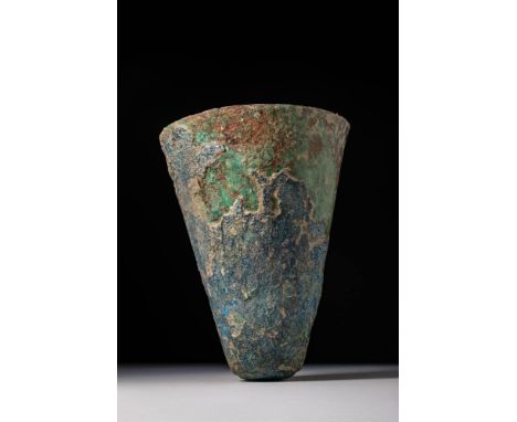 Ca. 2900 - 2300 BC. A tall bronze beaker with flaring walls and a conical form tapering towards a slightly rounded base.For s