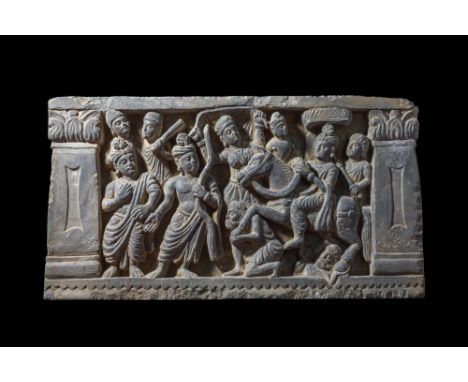 Ca. AD 2-3rd Century. A carved stone panel depicting the story of the Great Departure, when Prince Siddhartha left the palace