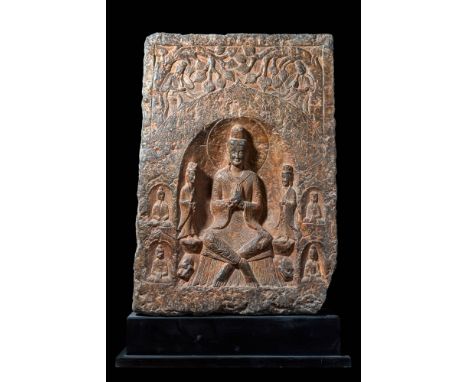 Ca. AD 386-534. A votive stele with a central image of a seated Buddha in dhyana mudra, flanked by two standing bodhisattvas 