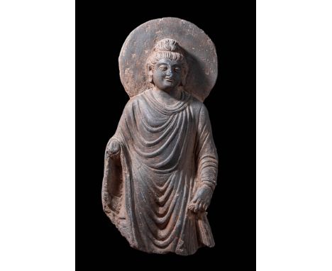Ca. AD 2-3rd Century. A stone carving of Matreiya. His hands in Abhaya mudra and with serene facial expression, dressed a lon
