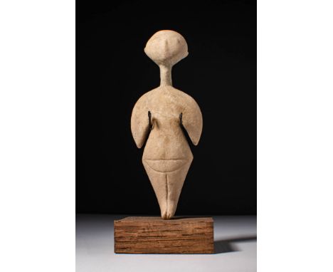 Ca. 2700 - 2400 BC. A stylised marble idol with a large circular head set on a slender neck, broad semi-circular shoulders, a