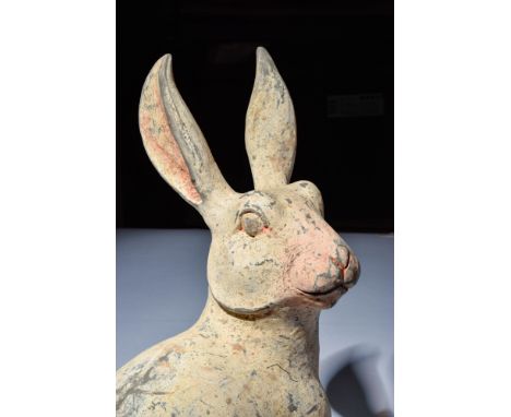 Ca. 202 BC - AD 220.A terracotta figure of a rabbit modelled in a seated posture, with forelegs straight and hind legs tucked