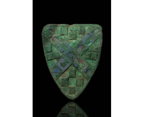 Ca. AD 1400 - 1500. A large bronze heraldic shield of heater shape, decorated with a raised saltire formed by two intersectin