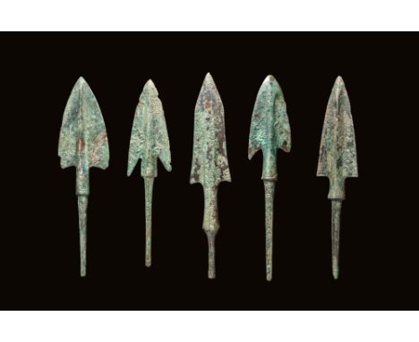 Ca. 1000 - 800 BC. A collection of five bronze arrowheads, comprising narrow-bladed types with sharply tapering forms and rai