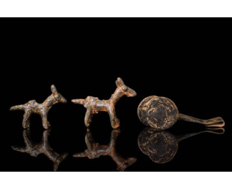 Ca. 1000 BC. A set composed of two solid cast bronze horses and a single cart element. Both horses are similarly stylised, wi