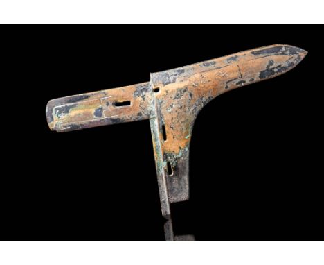 Han Dynasty, Ca. 206 BC - AD 220. A bronze halberd blade of the ge type with a long, tapering main blade and a shorter, recta