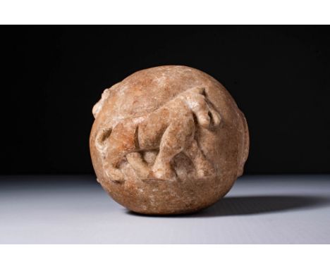 Ca. 3000 - 2700 BC.A stone mace head carved in a rounded form with relief representations of three animals in procession: a h