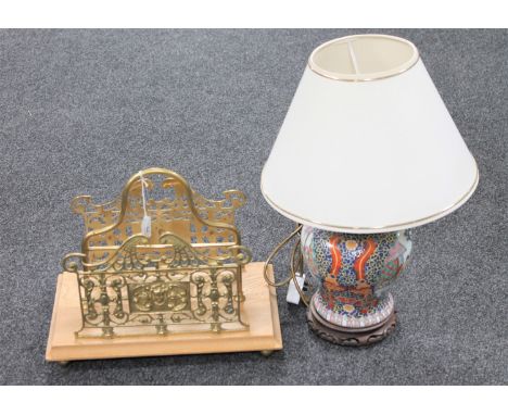 A wooden and brass magazine/correspondence rack together with an oriental porcelain table lamp with shade CONDITION REPORT: B