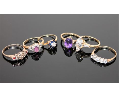 A 9ct gold amethyst and diamond ring, another 9ct gold amethyst set ring, three 9ct gold dress rings and a sapphire and diamo