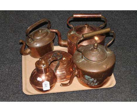 A tray of three antique copper kettles together with copper flask and bed warmer 