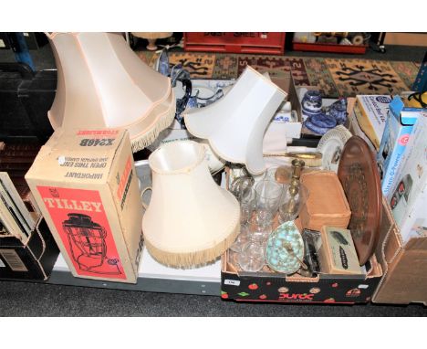 A boxed Tilley Stormlight, various table lamps and a box of glass ware, brass candlestick etc