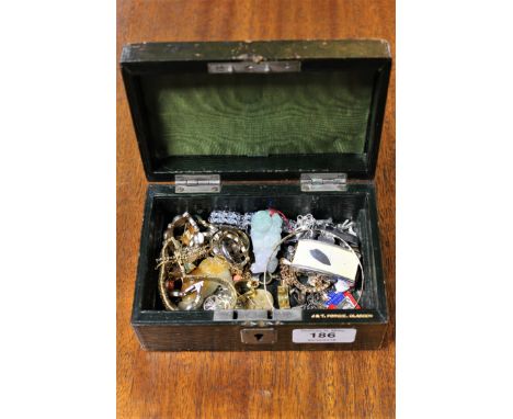 A small jewellery casket of costume jewellery, Chinese jade pendant, white metal chains, Ronson lighter etc