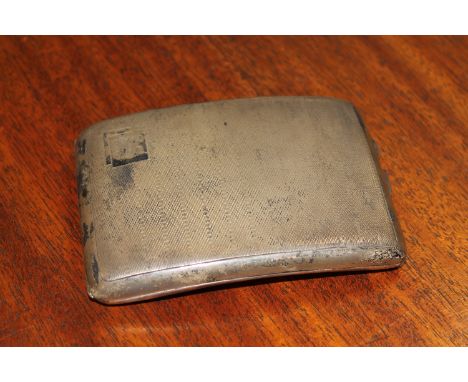 A curved silver cigarette case with engine turned decoration