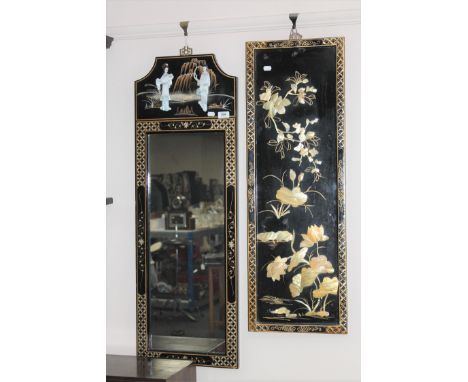 A Japanese lacquered framed hall mirror and a wall panel 