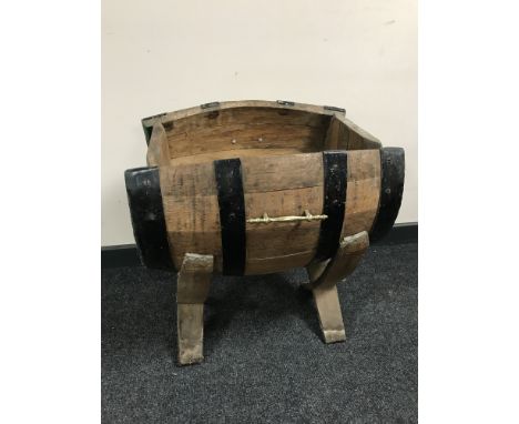An oak coopered barrel plant trough on stand 