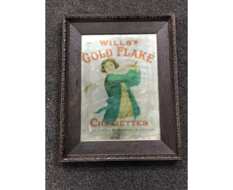 An early 20th century and later oak framed mirror bearing "Willows Gold Flake Cigarettes" advertisement 