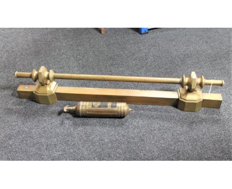 A vintage Pyrene fire extinguisher and a brass fire curb 