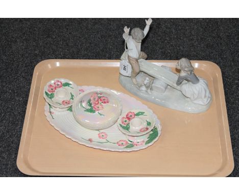 A Spanish figure of a girl and boy on seesaw, together with a four piece Maling trinket set 