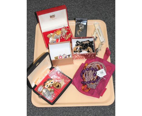 A tray of costume jewellery, enamel badges, silver toothpick, Scottish brooches etc