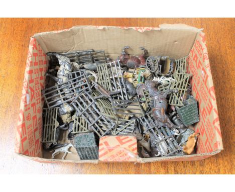 A box of vintage lead farm animals and accessories