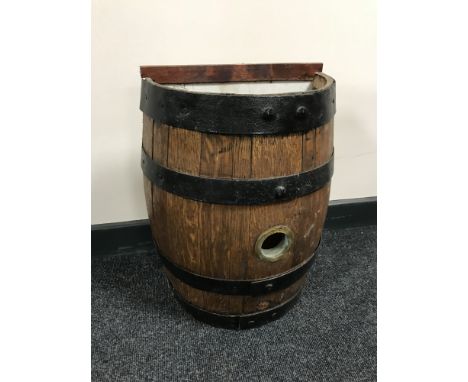 An oak coopered barrel stick stand 