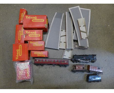 A collection of Tri-ang model rail wagons, accessories, and a locomotive 