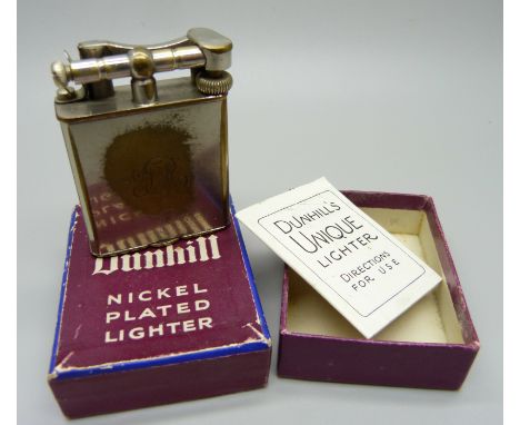 A nickel plated Dunhill lighter in original box with instruction leaflet 