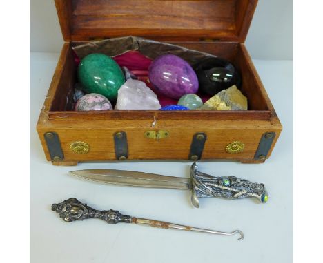A collection of mineral samples, a letter opener and a button hook 
