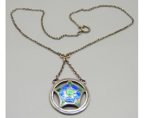 An Arts and Crafts silver and enamel pendant necklet 