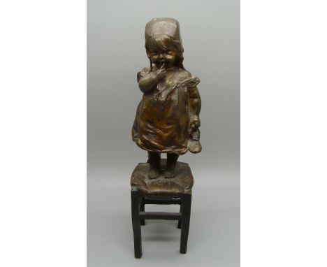 Juan Clara, 1875-1957, a bronze statue of a girl standing on a stool, foundry mark to base of seat, 22cm 