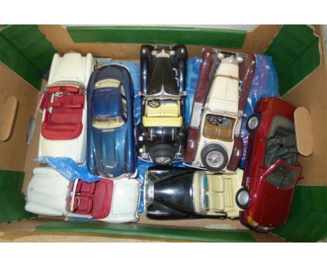 A collection of eleven Burago and Maisto model cars 