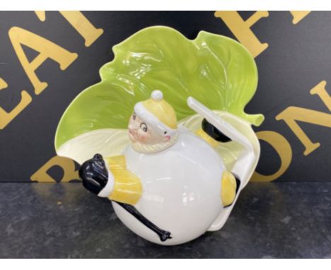 A vintage novelty Carlton ware teapot int the form of a skier, plus a Carlton ware leaf dish