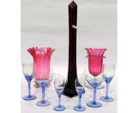 20th century amethyst art glass vase of tapering square form, a cranberry glass vase with lappet rim, on pedestal foot, anoth